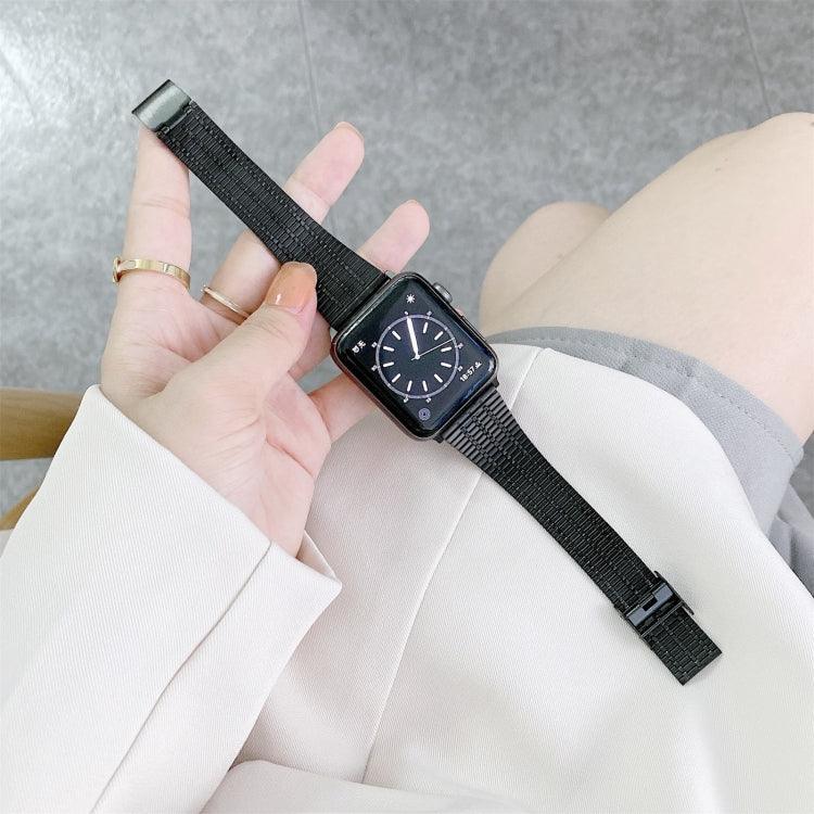 Steel replacement strap for Apple Watch shown on wrist with black watch face and band.