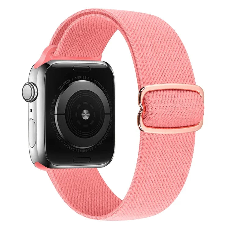 Pink nylon replacement strap for Apple Watch, comfortable, adjustable, stylish, compatible with multiple series.