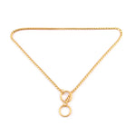 metal dog collar in gold tone, featuring a twisted chain design with two circular connectors.