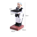 Decorative watch display stand featuring a large old butler holding a black tray, crafted from resin.